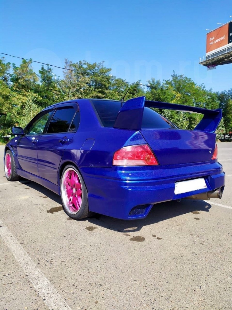 Mitsubishi Lancer Evolution VII roues Piaa Roza Four R18